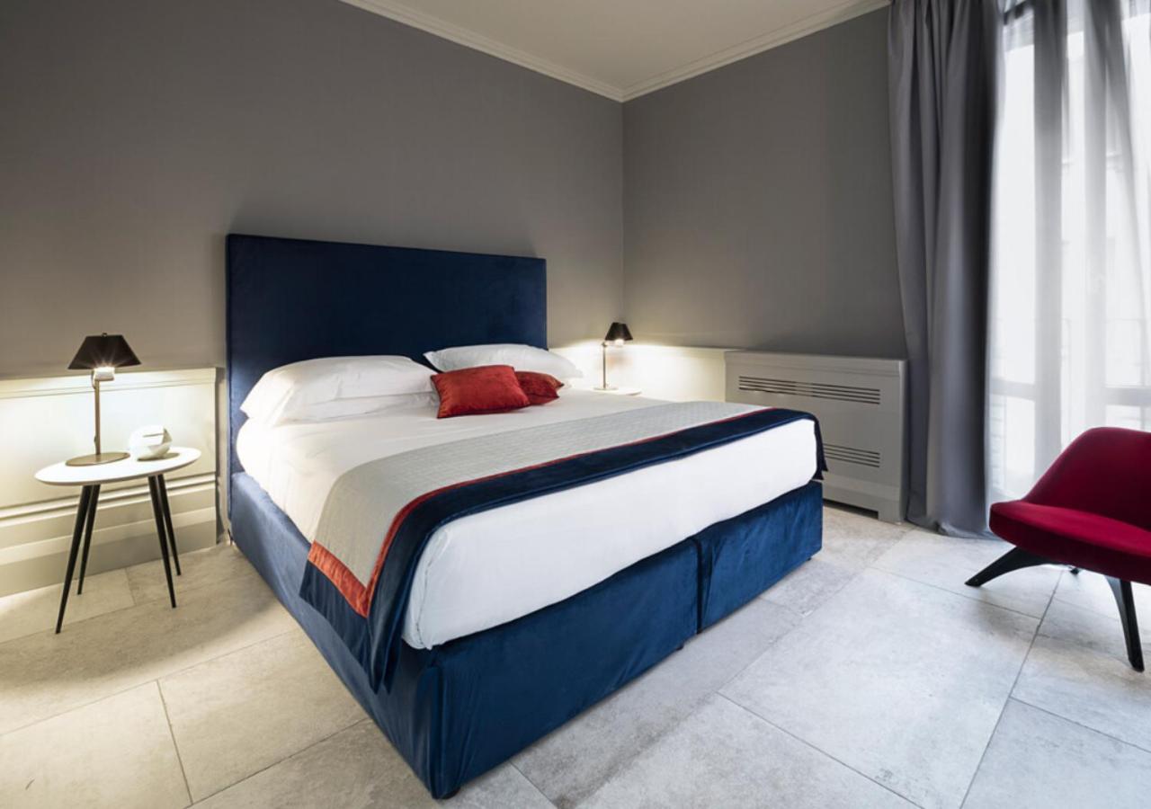Palazzo Cornalia Hotel Milánó Kültér fotó A bedroom at the hotel